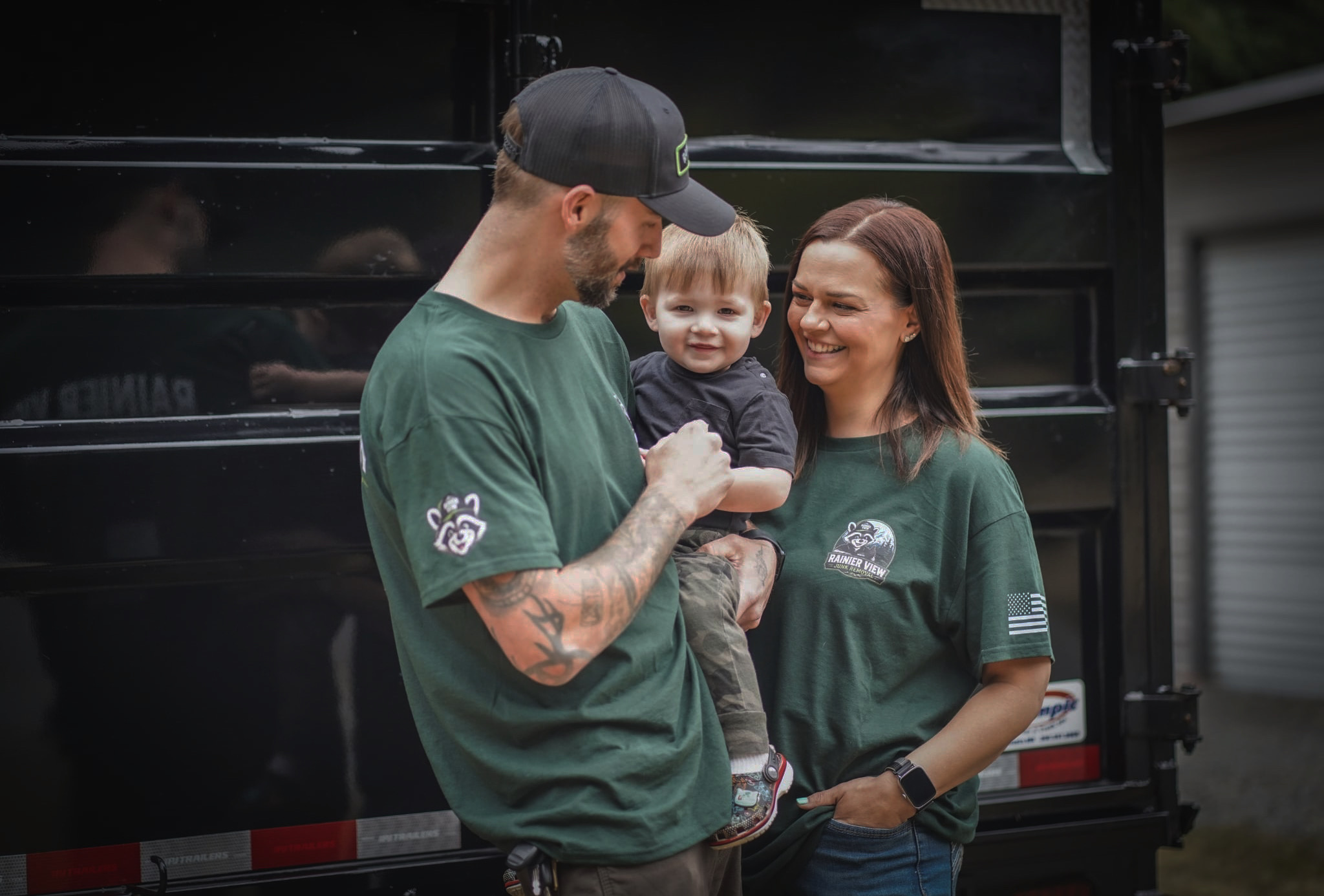 Josh and Dahni Campbell with their son, owners of Rainier View Junk Removal